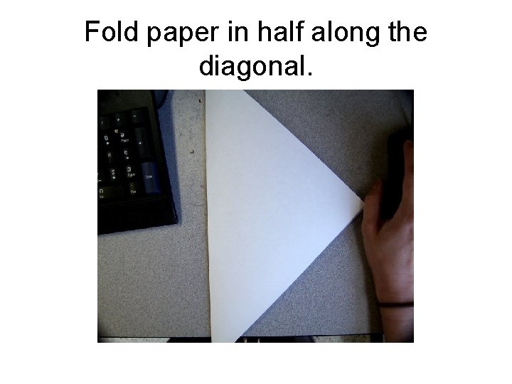 Fold paper in half along the diagonal. 