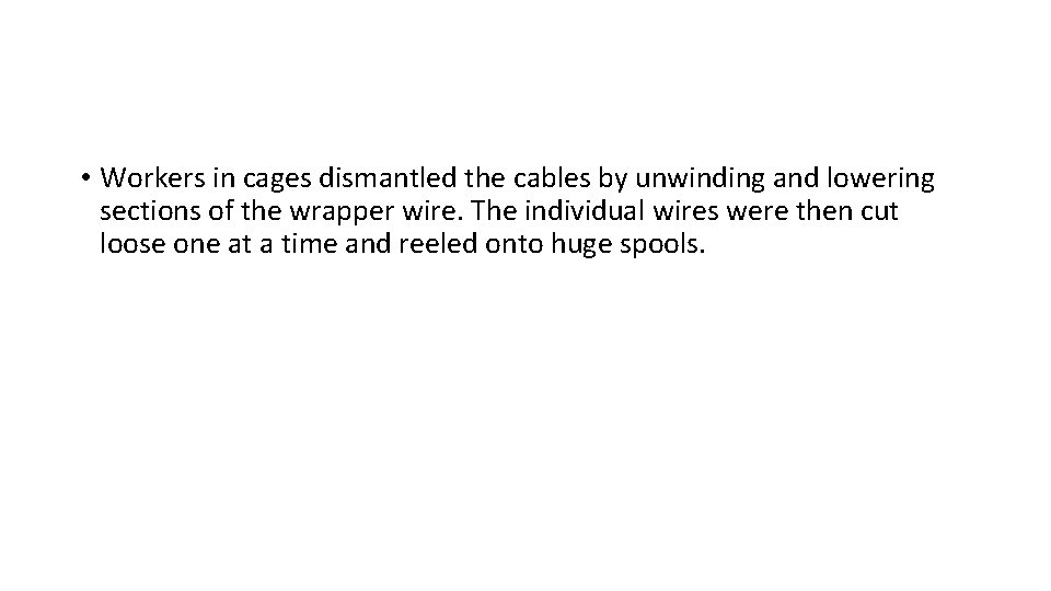  • Workers in cages dismantled the cables by unwinding and lowering sections of