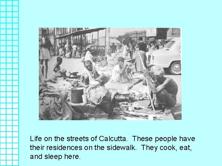 Life on the streets of Calcutta. These people have their residences on the sidewalk.