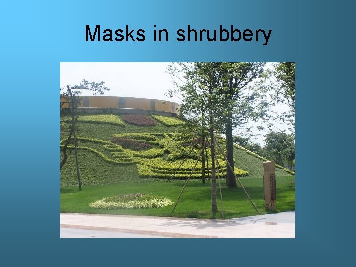 Masks in shrubbery 