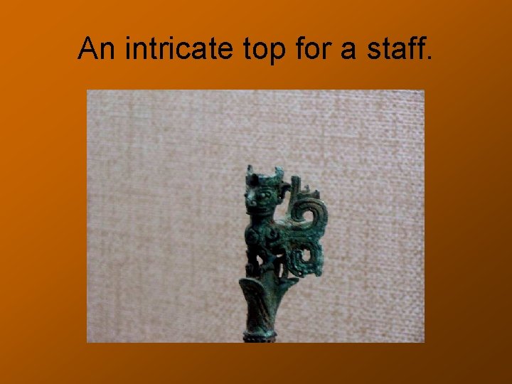 An intricate top for a staff. 