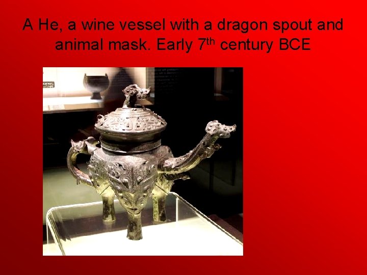 A He, a wine vessel with a dragon spout and animal mask. Early 7