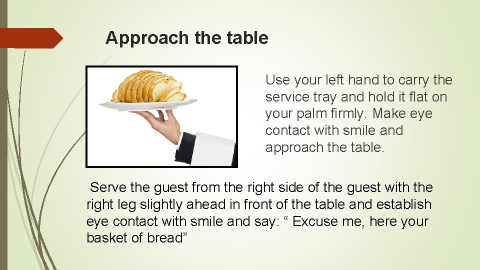 Approach the table Use your left hand to carry the service tray and hold