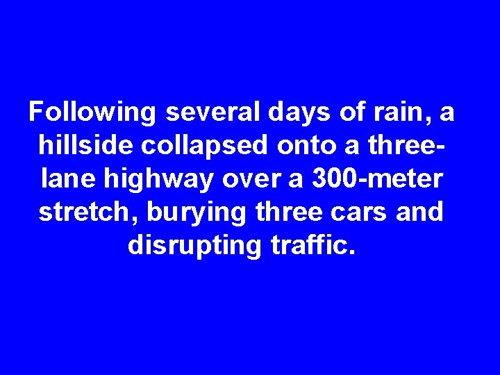 Following several days of rain, a hillside collapsed onto a threelane highway over a