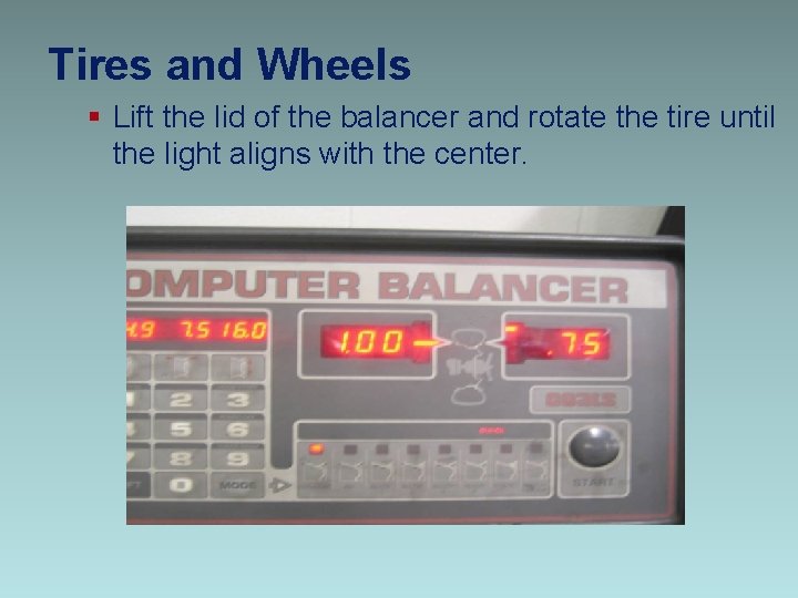 Tires and Wheels § Lift the lid of the balancer and rotate the tire