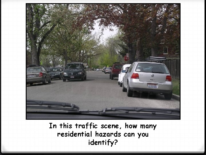 In this traffic scene, how many residential hazards can you identify? 