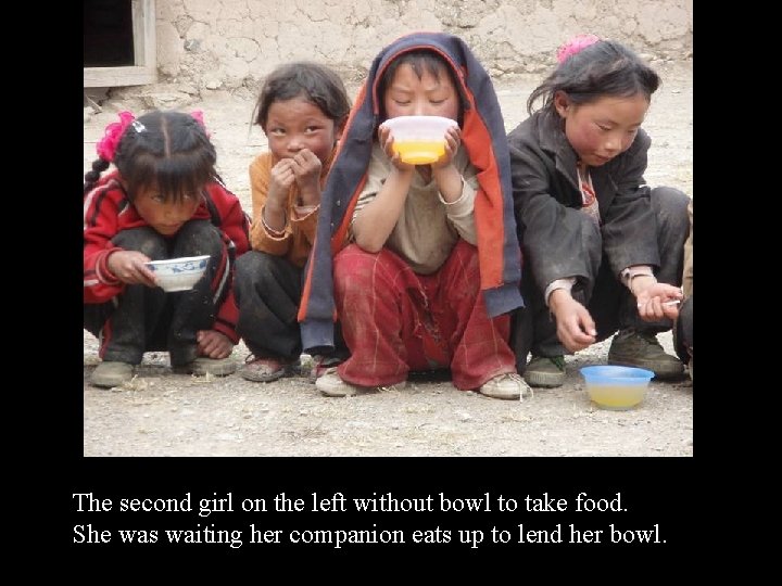 The second girl on the left without bowl to take food. She was waiting