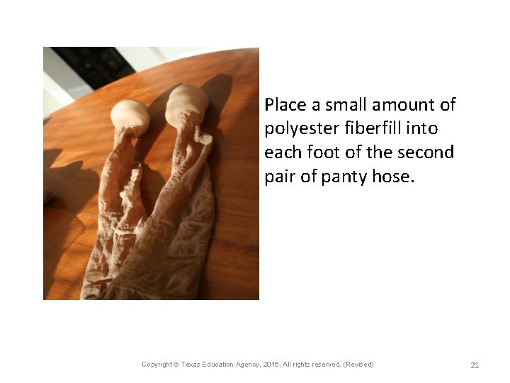 Place a small amount of polyester fiberfill into each foot of the second pair