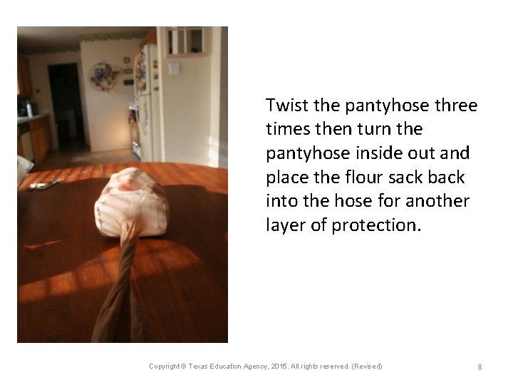 Twist the pantyhose three times then turn the pantyhose inside out and place the