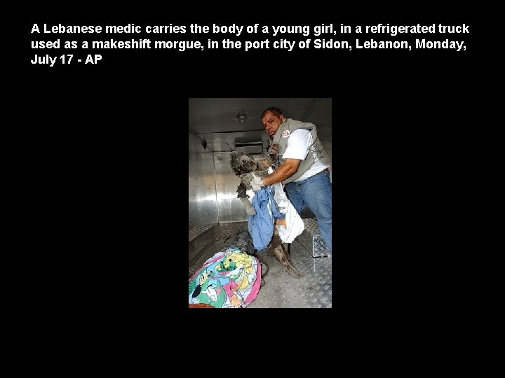 A Lebanese medic carries the body of a young girl, in a refrigerated truck