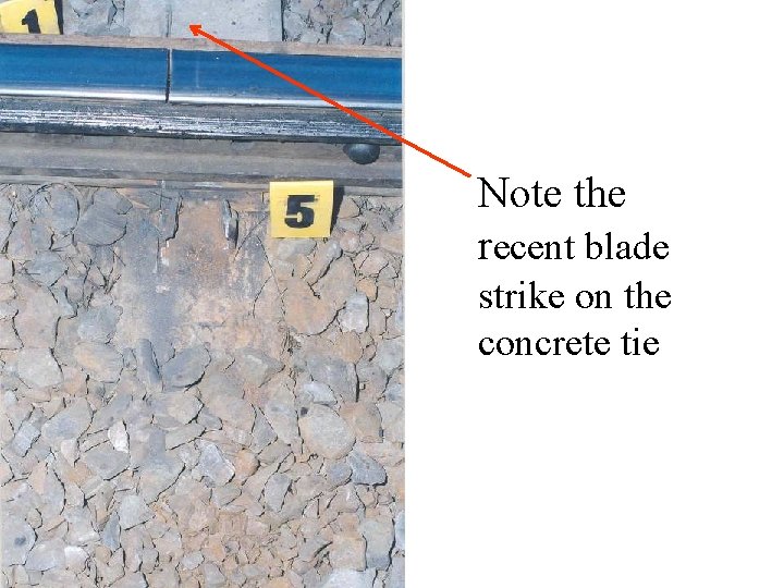 Note the recent blade strike on the concrete tie 