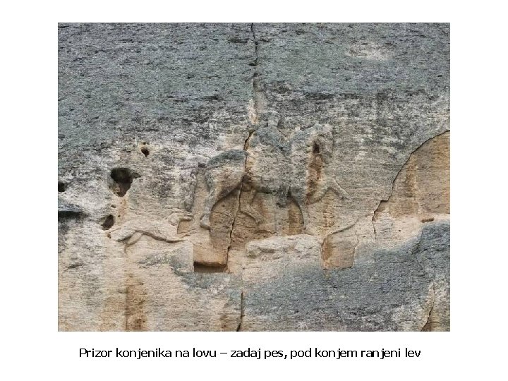 Prizor konjenika na lovu – zadaj pes, pod konjem ranjeni lev 
