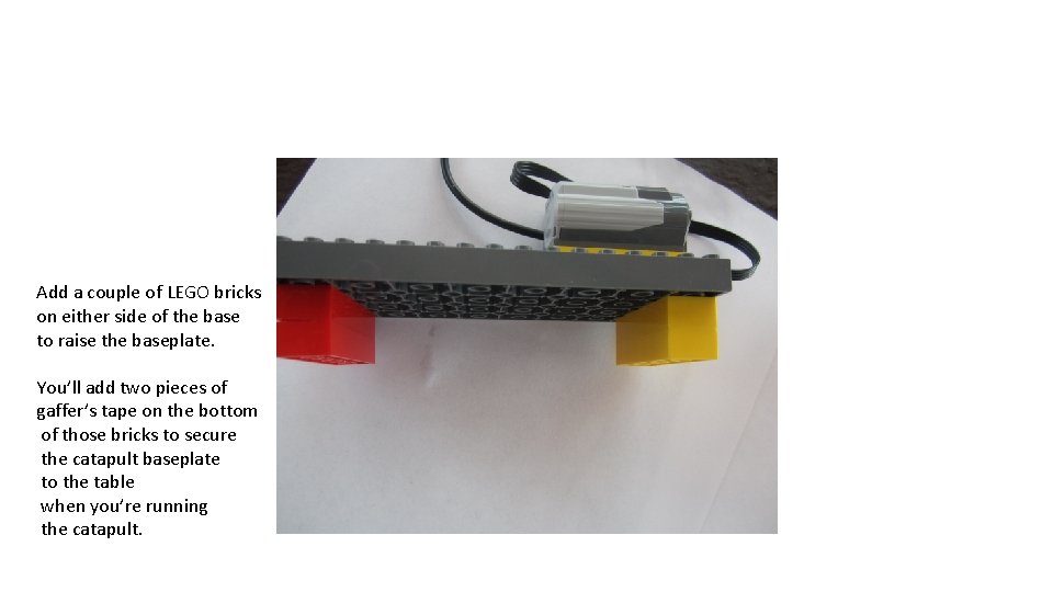 Add a couple of LEGO bricks on either side of the base to raise
