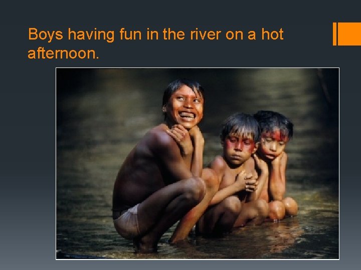 Boys having fun in the river on a hot afternoon. 
