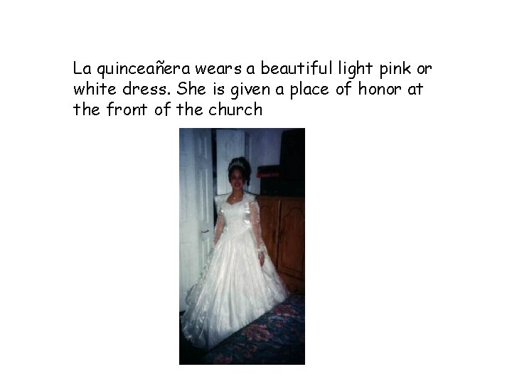 La quinceañera wears a beautiful light pink or white dress. She is given a