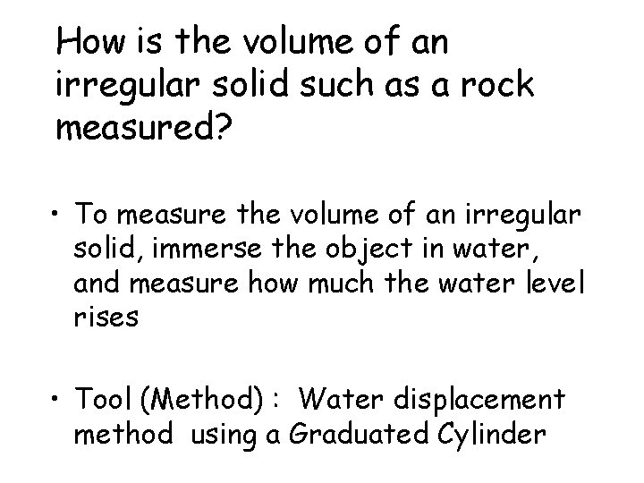 How is the volume of an irregular solid such as a rock measured? •