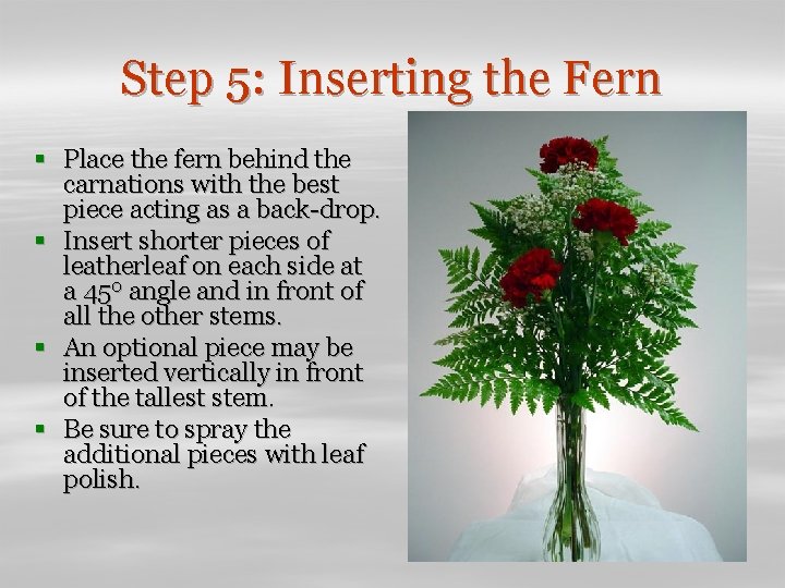 Step 5: Inserting the Fern § Place the fern behind the carnations with the