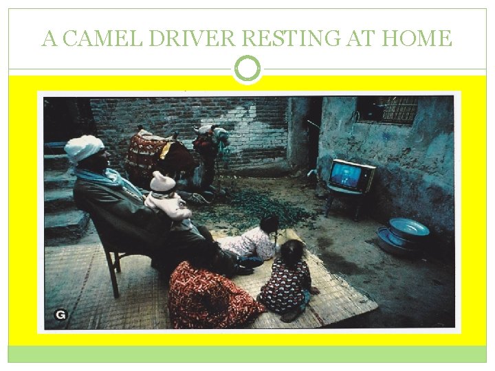 A CAMEL DRIVER RESTING AT HOME 