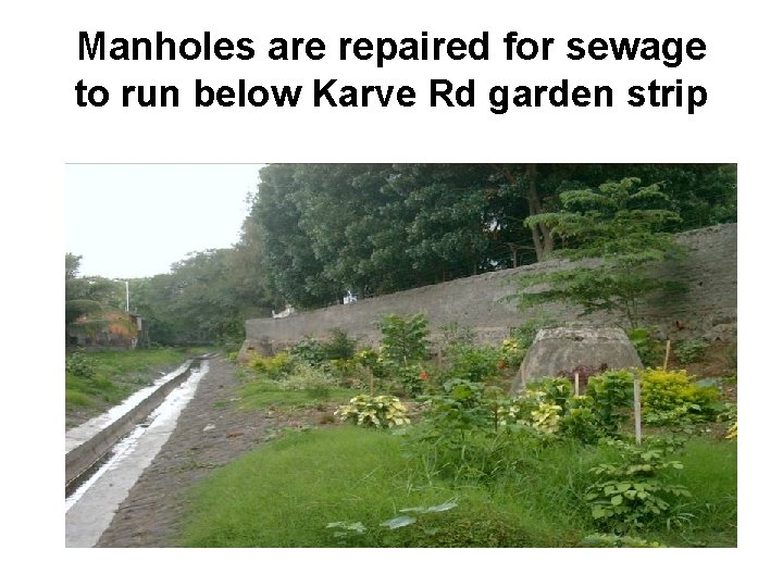 Manholes are repaired for sewage to run below Karve Rd garden strip 