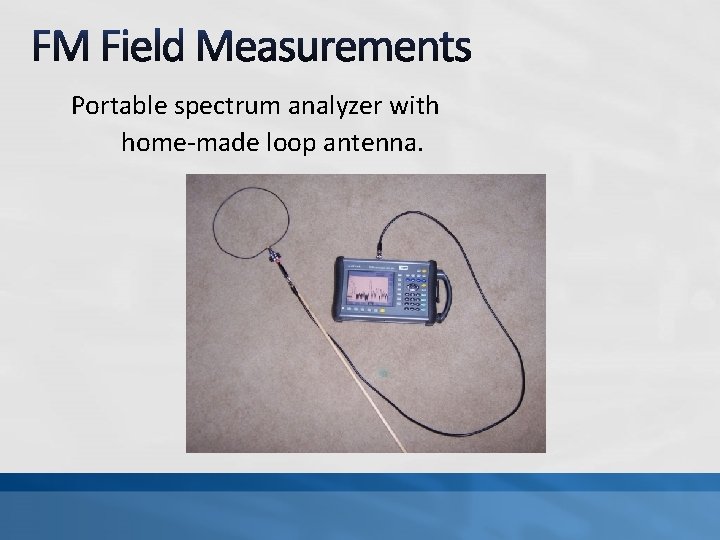 Portable spectrum analyzer with home-made loop antenna. 