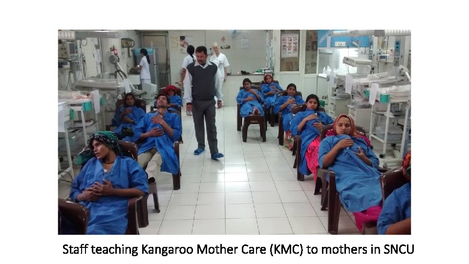 Staff teaching Kangaroo Mother Care (KMC) to mothers in SNCU 