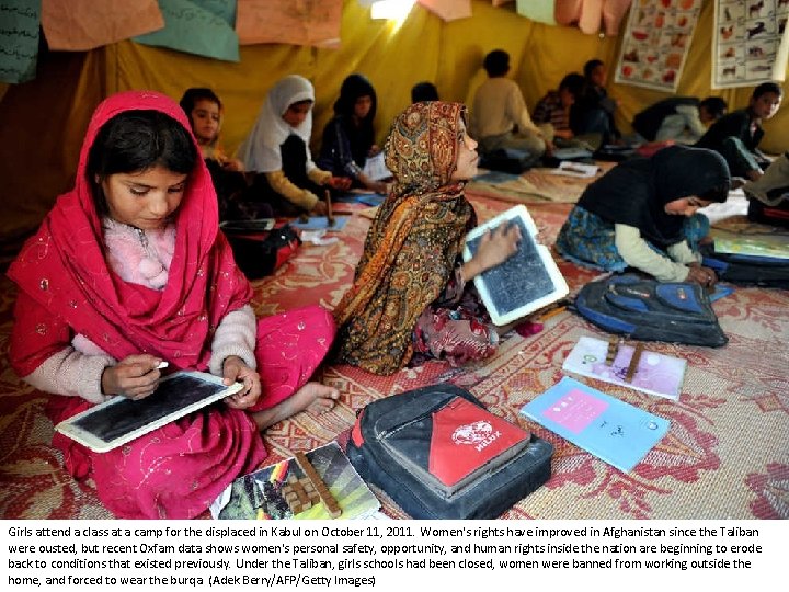 Girls attend a class at a camp for the displaced in Kabul on October