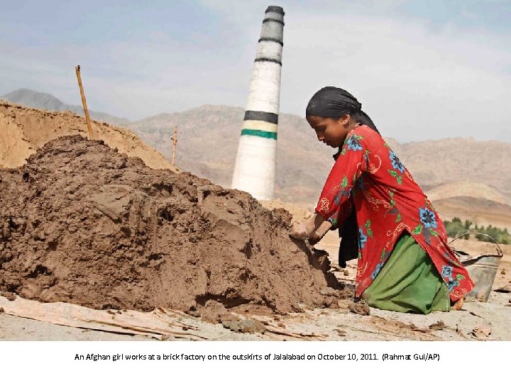 An Afghan girl works at a brick factory on the outskirts of Jalalabad on