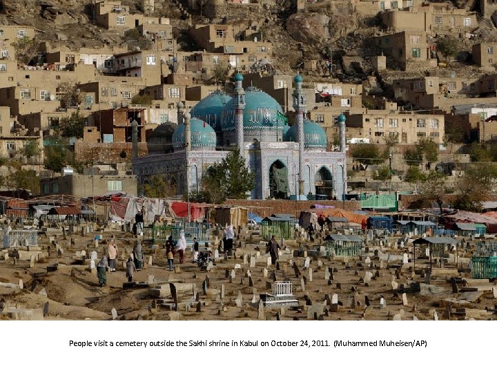 People visit a cemetery outside the Sakhi shrine in Kabul on October 24, 2011.