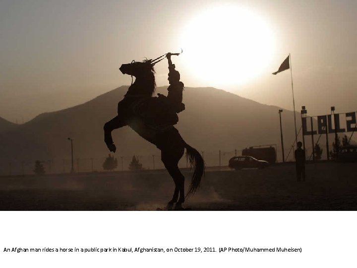 An Afghan man rides a horse in a public park in Kabul, Afghanistan, on