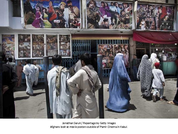 Jonathan Saruk / Reportage by Getty Images Afghans look at movie posters outside of