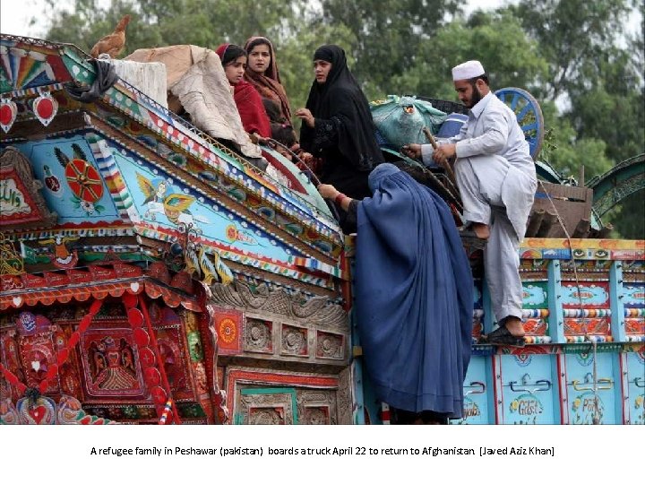 A refugee family in Peshawar (pakistan) boards a truck April 22 to return to