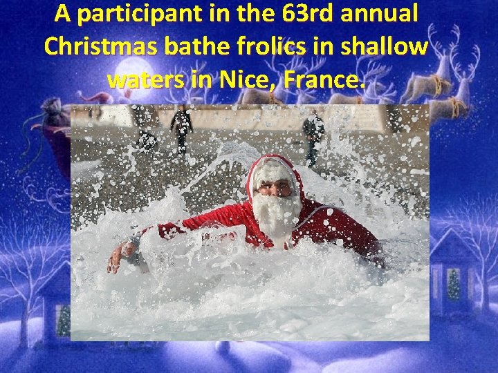 A participant in the 63 rd annual Christmas bathe frolics in shallow waters in