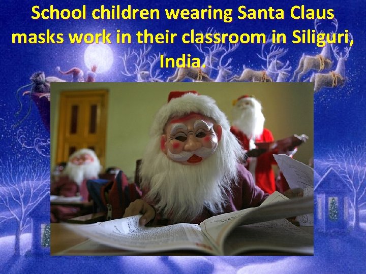 School children wearing Santa Claus masks work in their classroom in Siliguri, India. 
