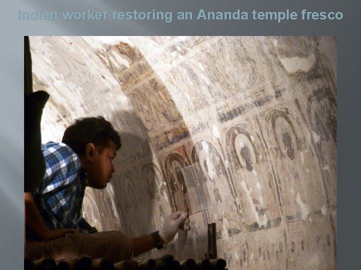 Indian worker restoring an Ananda temple fresco 