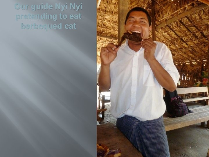 Our guide Nyi pretending to eat barbequed cat 