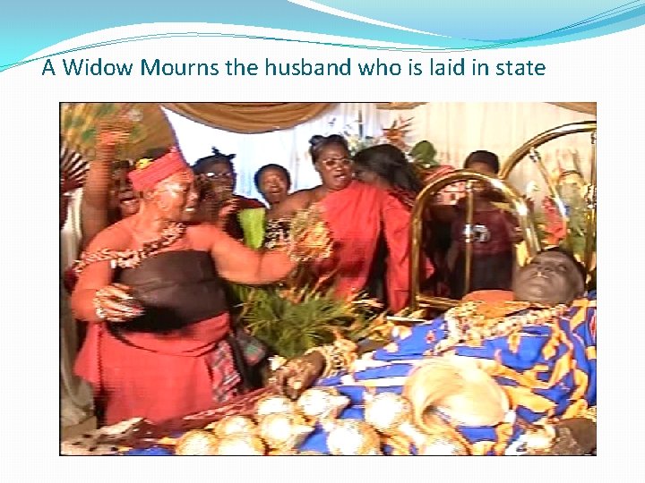 A Widow Mourns the husband who is laid in state 