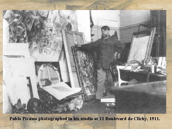 Pablo Picasso photographed in his studio at 11 Boulevard de Clichy, 1911. 