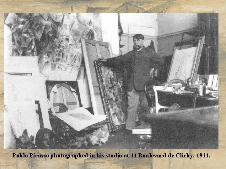 Pablo Picasso photographed in his studio at 11 Boulevard de Clichy, 1911. Pablo Picasso photographed in his studio at 11 Boulevard de Clichy, 1911.