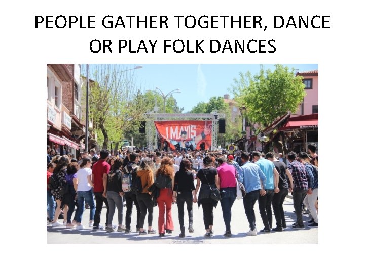 PEOPLE GATHER TOGETHER, DANCE OR PLAY FOLK DANCES 