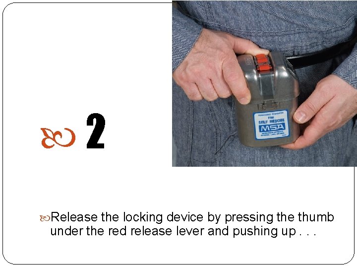  2 Release the locking device by pressing the thumb under the red release