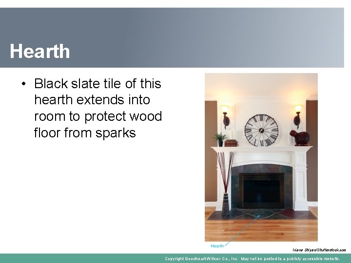 Hearth • Black slate tile of this hearth extends into room to protect wood