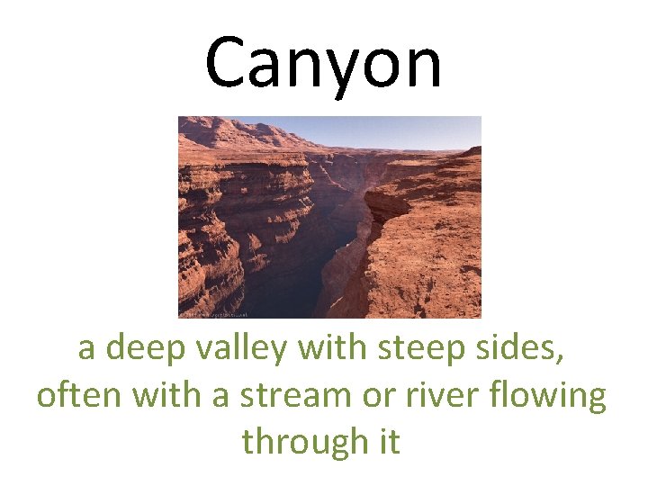 Canyon a deep valley with steep sides, often with a stream or river flowing