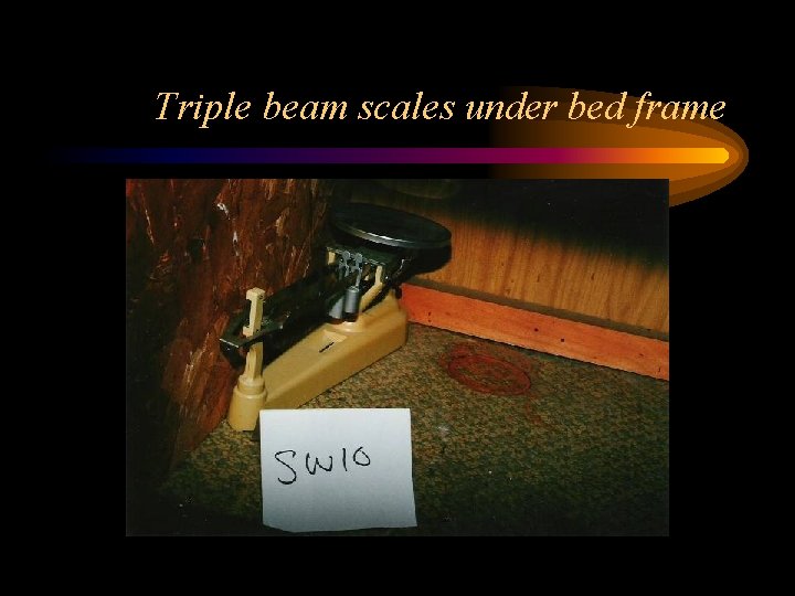 Triple beam scales under bed frame 