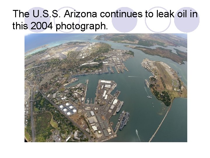 The U. S. S. Arizona continues to leak oil in this 2004 photograph. 