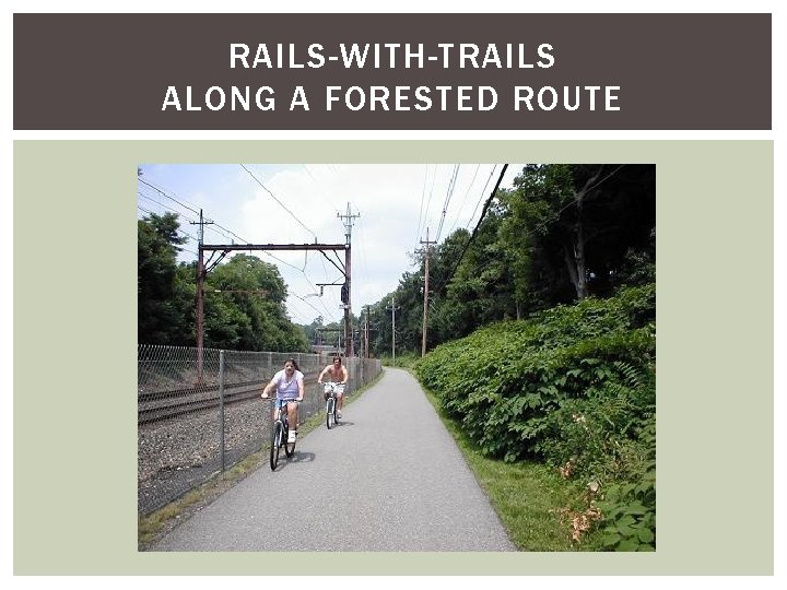 RAILS-WITH-TRAILS ALONG A FORESTED ROUTE 