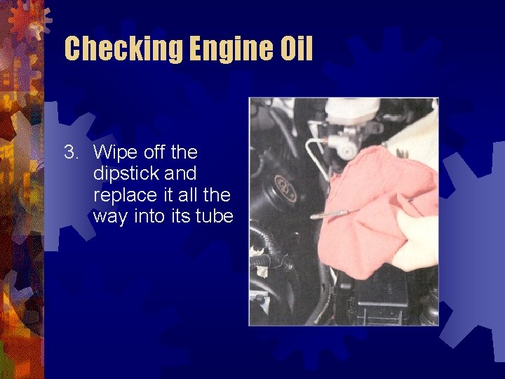 Checking Engine Oil 3. Wipe off the dipstick and replace it all the way