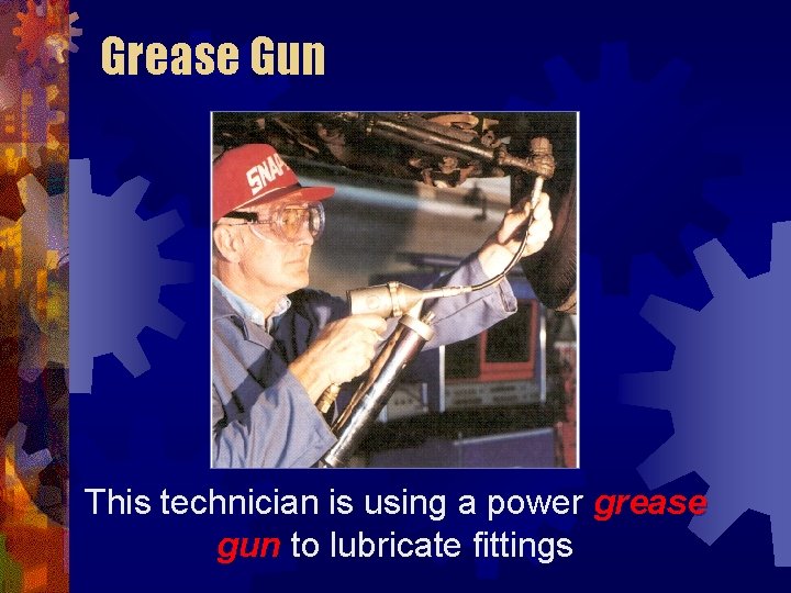 Grease Gun This technician is using a power grease gun to lubricate fittings 