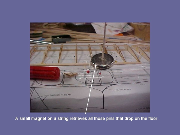 A small magnet on a string retrieves all those pins that drop on the