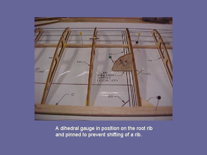 A dihedral gauge in position on the root rib and pinned to prevent shifting
