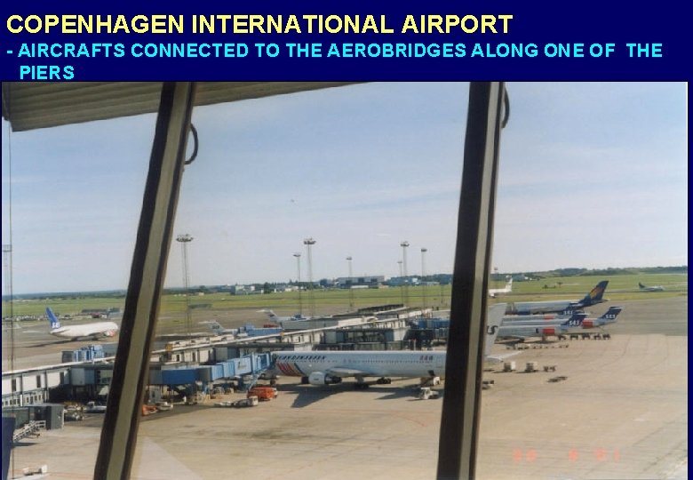 COPENHAGEN INTERNATIONAL AIRPORT - AIRCRAFTS CONNECTED TO THE AEROBRIDGES ALONG ONE OF THE PIERS